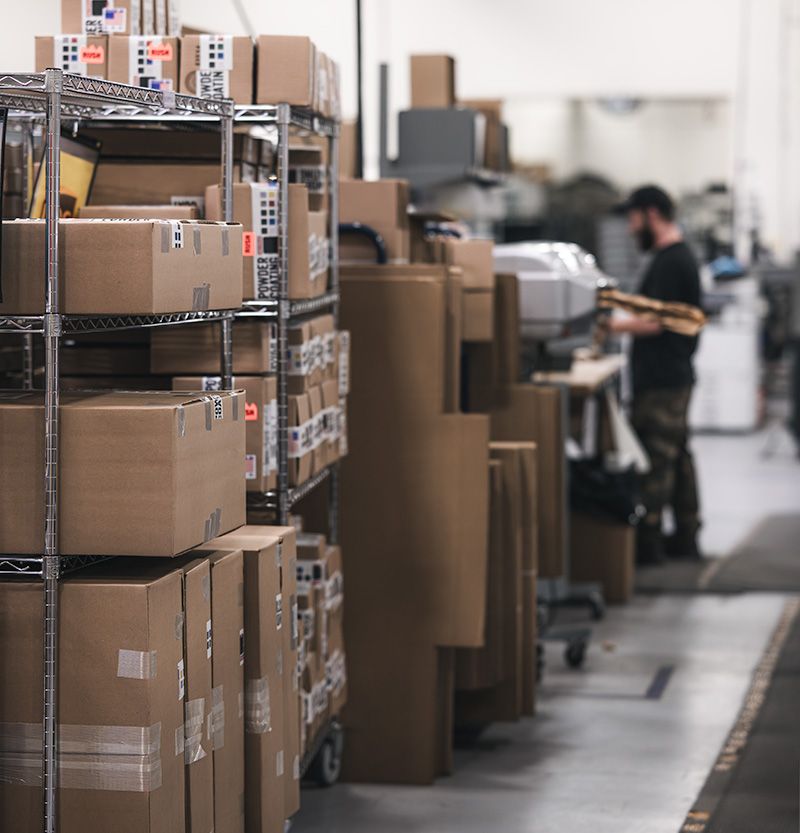 SendCutSend shipping floor with packaged parts ready for dispatch